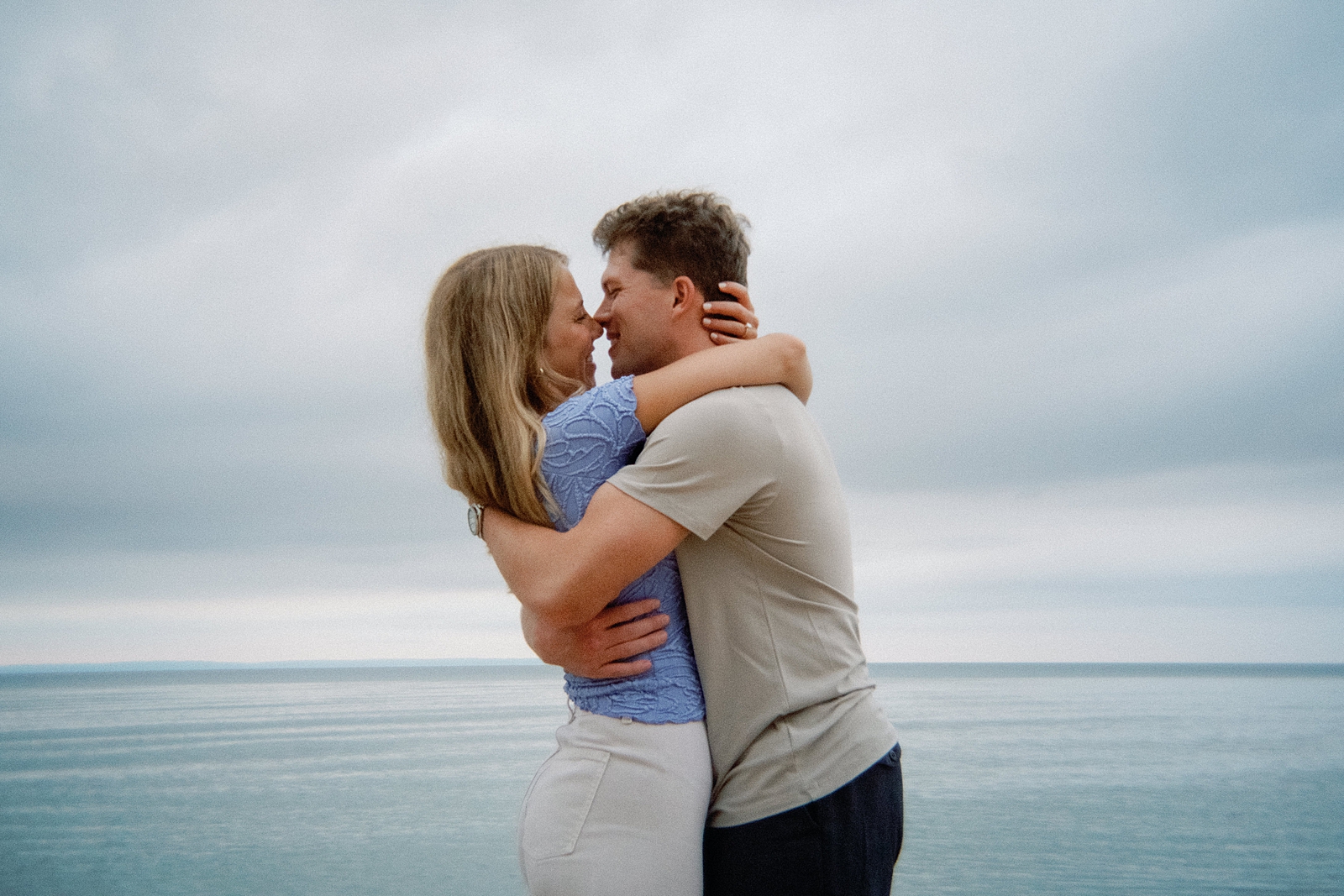 couple on the beach in leland michigan during engagement session